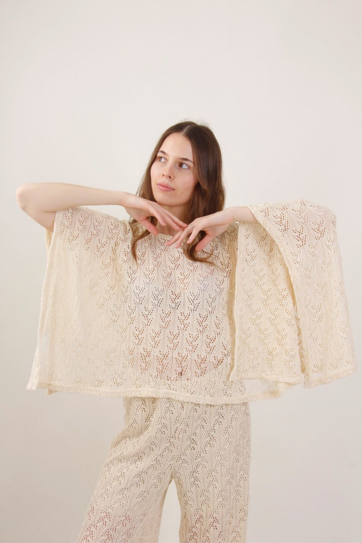 PONCHO TRAFORATO ASIMMETRICO