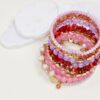 SET DI BRACCIALI CON PERLE E DETTAGLI DORATI - Rosa, TU