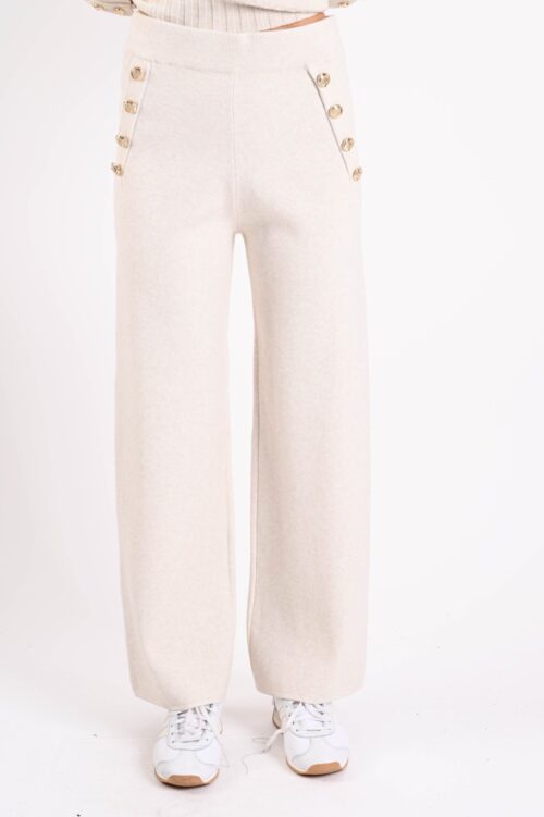 PANTALONI IN MAGLIA CON BOTTONI DORATI