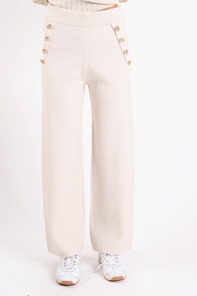 PANTALONI IN MAGLIA CON BOTTONI DORATI 