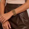 BRACCIALE CON ELEMENTI GEOMETRICI E PERLINE